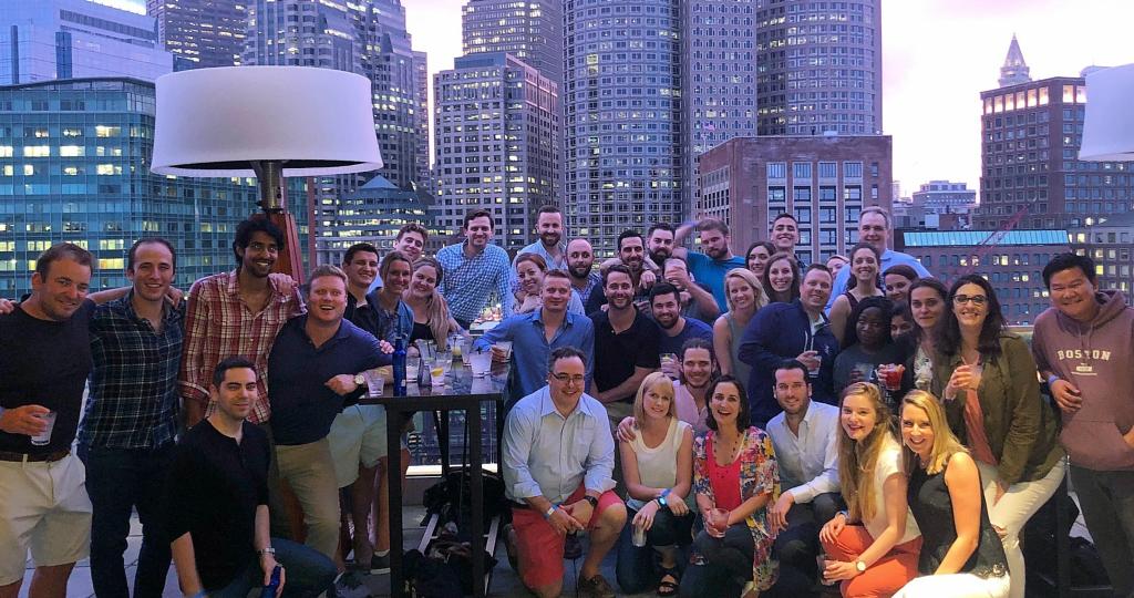 Large group of people in front of a cityscape