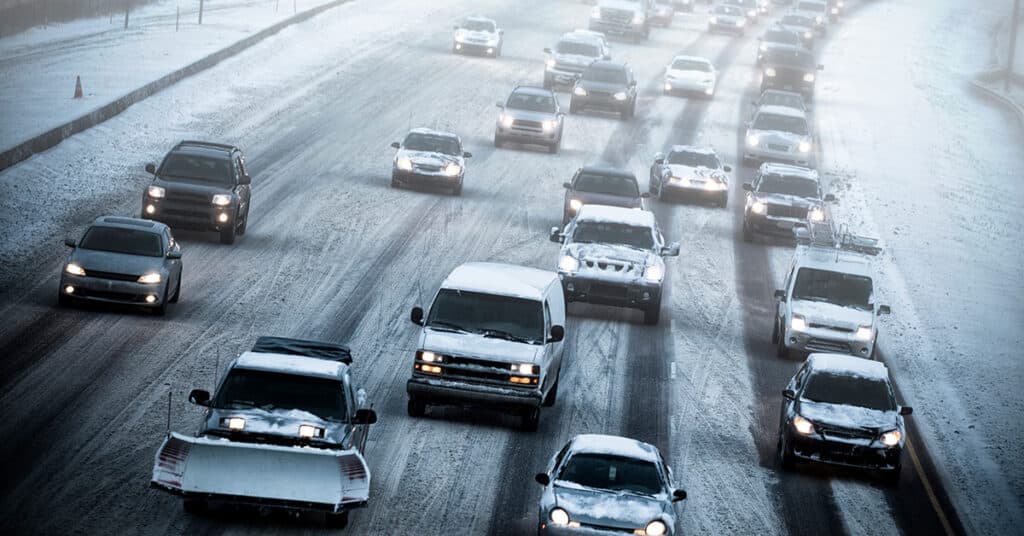 heavy traffic on a snowy street evoking driving safely this holiday season