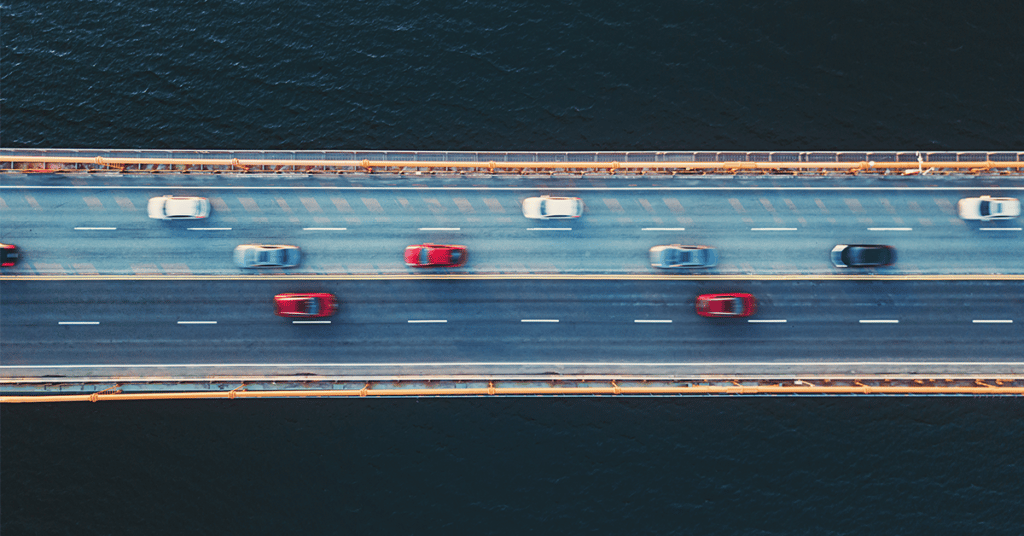 image of cars driving over bridge evoking mobile workforce