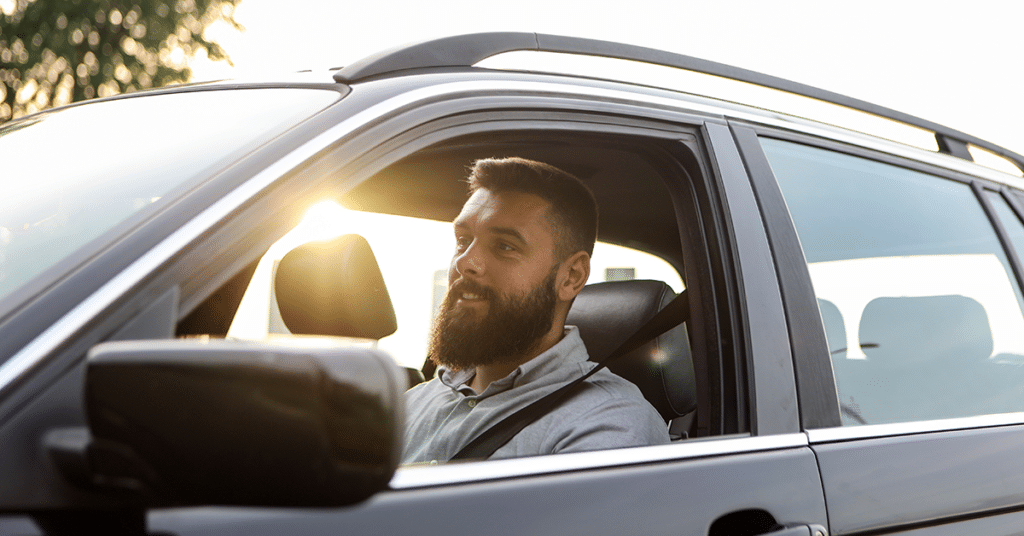 Man behind the wheel driving his SUV