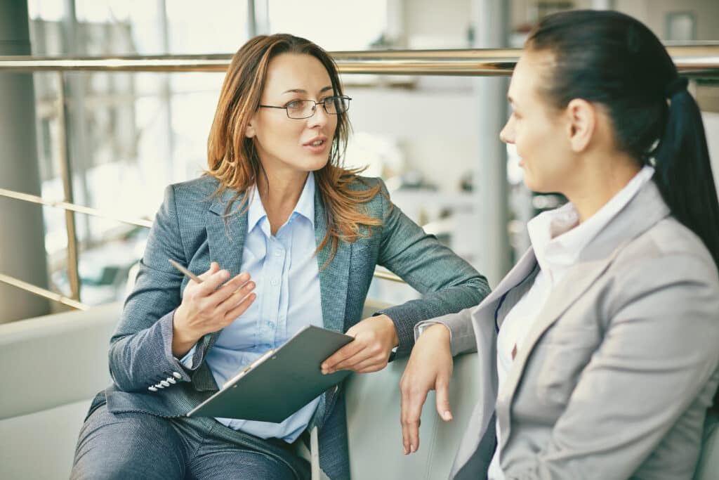 Image of two women having a discussion asking Questions By Drivers Transitioning From Car Allowance