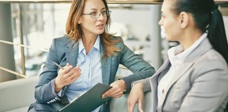 Image of two women having a discussion asking Questions By Drivers Transitioning From Car Allowance