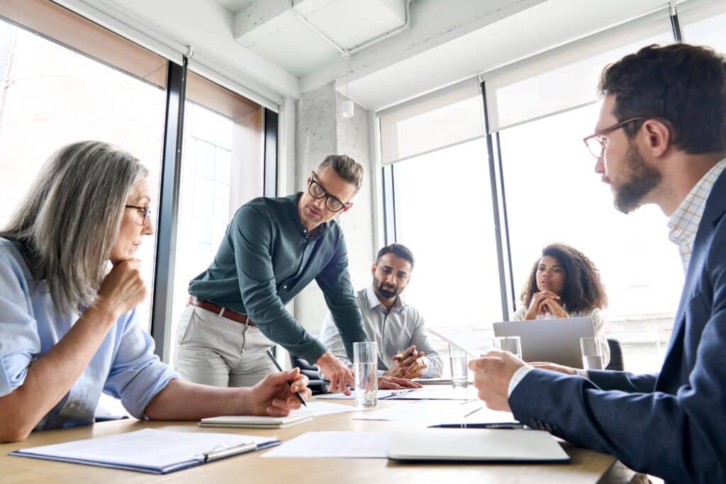 Image of a group of employees talking to each other